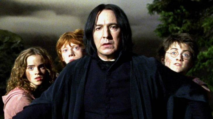 Alan Rickman as Severus Snape in Harry Potter and the Prisoner of Azkaban, along with fellow cast members Emma Watson, Rupert Grint and Daniel Radcliffe.