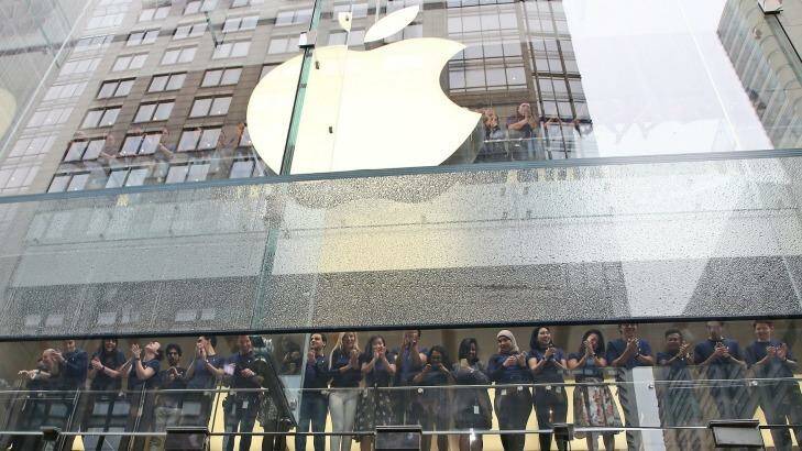 Staff at the Apple store in Sydney. Apple is one of many US multinationals that has been criticised for not paying enough tax in Australia.  Photo: Rob Griffith