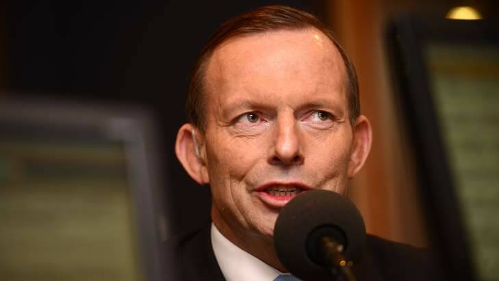 Prime Minister Tony Abbott says he made a mistake to wink during an interview on the budget with a sex hotline worker. Photo: Penny Stephens