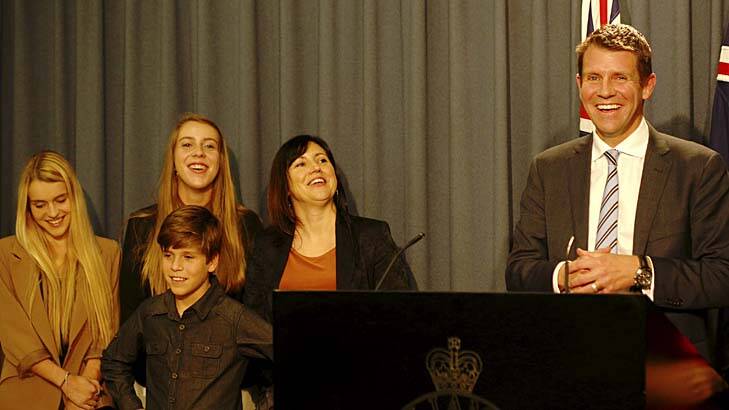 Rosebud family: Mike Baird addresses the media, with wife Kerryn and their children. Photo: James Brickwood