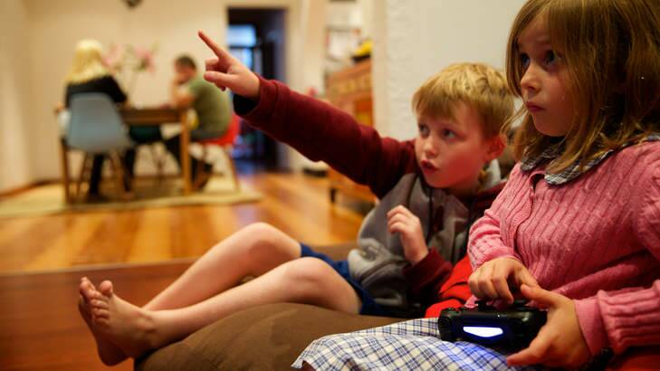 Liam Hunter, 9, and Eve Hunter, 6, play <i>Minecraft</i> at their Leichhardt home. Photo: Wolter Peeters