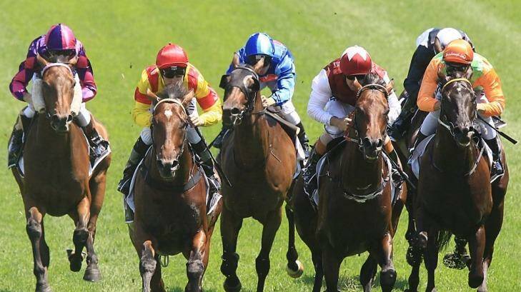 Made to order: Order Of The Sun (red cap) scores at Randwick in February. Photo: Jenny Evans
