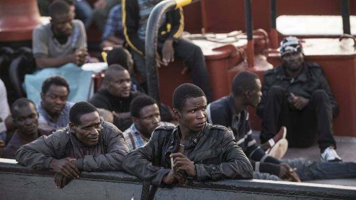 Endangered lives: Refugees on an Italian commercial ship after being intercepted and rescued at sea. Photo: New York Times