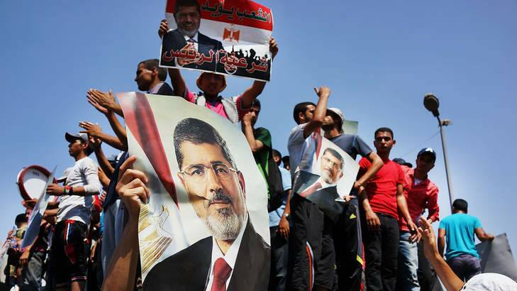 Supporters of former Egyptian President Mohammed Morsi march in protest over his removal by the Egyptian military on July 5, 2013. Photo: Getty Images