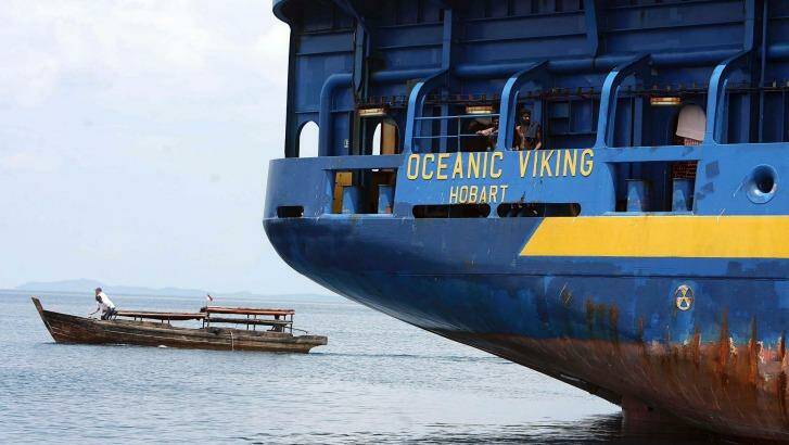 The Australian customs vessel the Ocean Viking, carrying Sri Lankan asylum seekers, and a traditional Indonesian boat off Bintan Island, Indonesia in October 2009.  Photo: Yuli Seperi