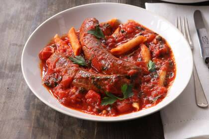 Greek sausages in tomato and caper stew.