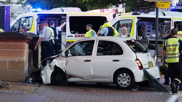 The badly damaged Nissan Micra came to rest on the footpath on Murray Street in Pyrmont. Photo: James Brickwood