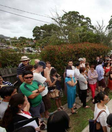 A massive crowd at an auction in North Ryde in February. Photo: Fiona Morris