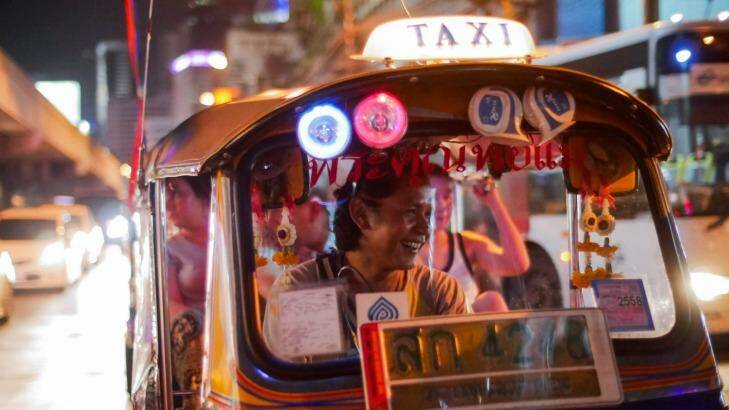 See, smell and taste Bangkok from the back of a tuk-tuk.