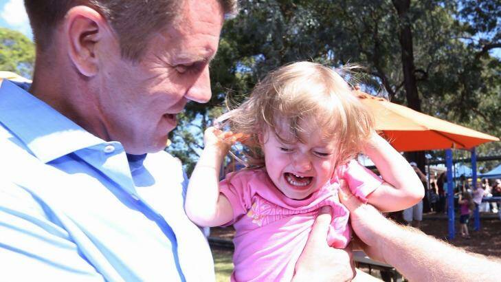 Two-year-old Grace at Padstow  Park Primary School on Saturday may have provided the Premier's only moment when he received a not-so-positive reaction Photo: Andrew Meares