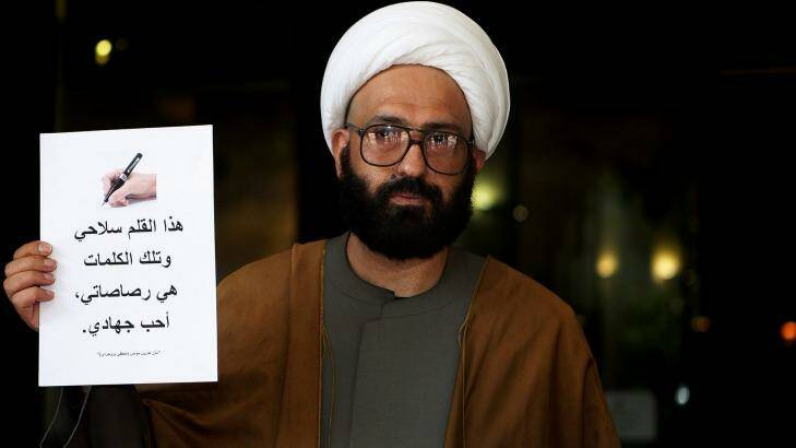 Man Haron Monis holds a sign outside the Downing Centre courts in 2010. Photo: Kate Geraghty