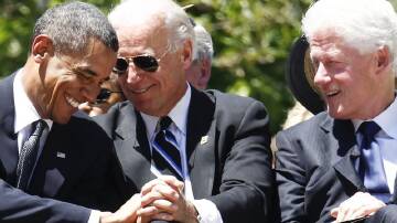 A photo together with Barack Obama, Joe Biden and Bill Clinton will cost donors $US100,000. (AP PHOTO)