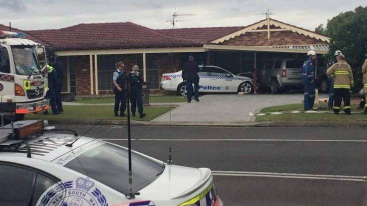 The scene at Ashtonfield after a house was hit by a police car allegedly driven by a handcuffed man on Sunday. Photo: Supplied