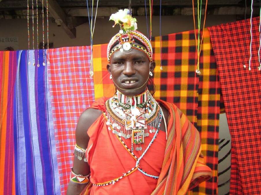 Young Masai man outside a shop in Nairobi.
 Photo: Louise Southerden