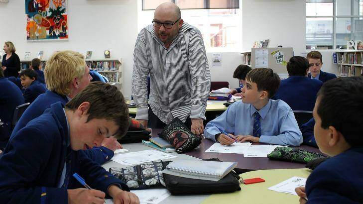 Laptop to letters: Richard Simpkin with Waverly College students. Photo: Sahlan Hayes/Getty Images