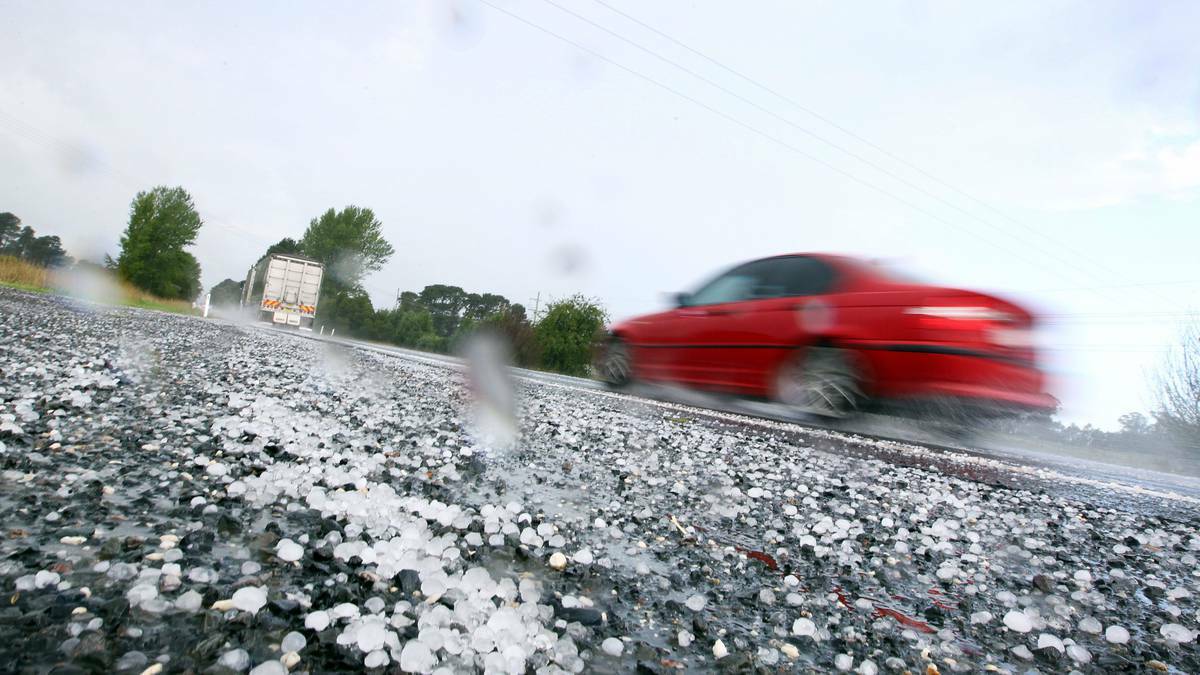 Drivers negotiate a hail storm on the Illawarra Highway in the Southern Highlands. Photo: SYLVIA LIBER