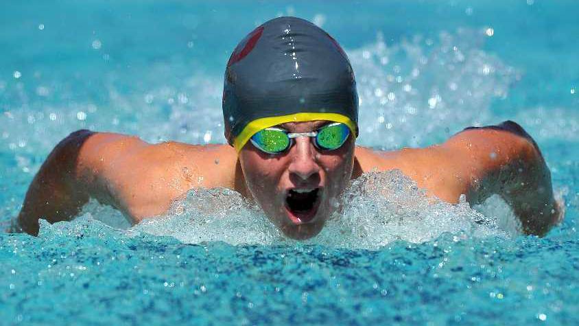 Rhys Mooney from Mater Dei in the process of breaking a record at the BISSA swimming carnival. Photo: MICHAEL FROGLEY