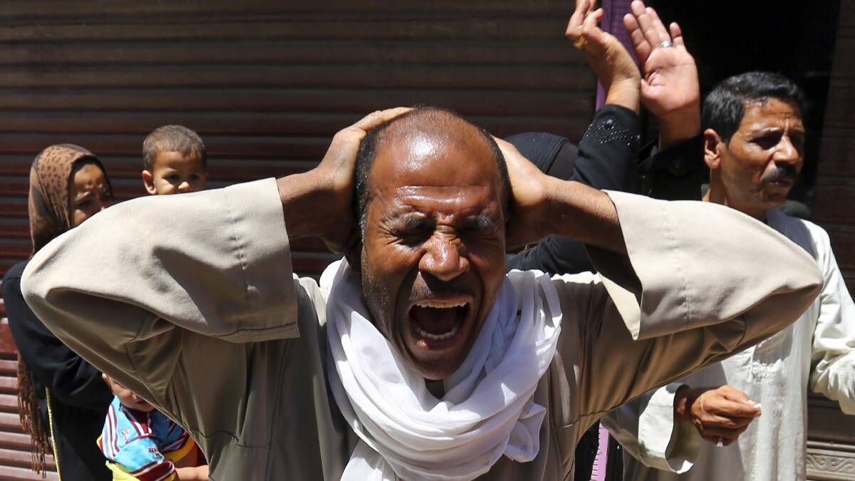 Relatives and families of members of the Muslim Brotherhood and supporters of ousted Egyptian President Mohamed Mursi react outside a court in Minya, south of Cairo, after the sentences of Muslim Brotherhood leader Mohamed Badie and his supporters were announced, June 21, 2014. Picture: Reuters.