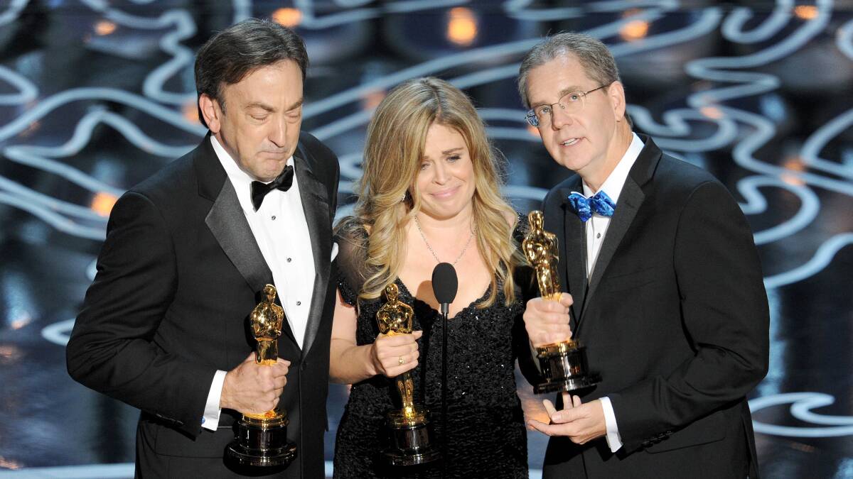 (L-R) Producer Peter Del Vecho, directors Jennifer Lee and Chris Buck accept the Best Animated Feature Film award for 'Frozen' onstage during the Oscars at the Dolby Theatre on March 2, 2014 in Hollywood Photo: GETTY IMAGES