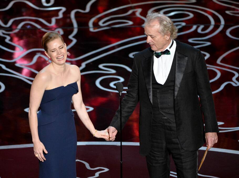 Actors Amy Adams (L) and Bill Murray speak onstage during the Oscars at the Dolby Theatre on March 2, 2014 in Hollywood Photo: GETTY IMAGES