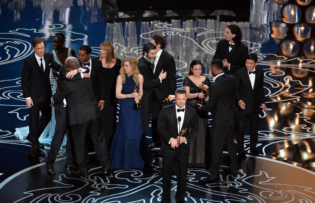 Actor/producer Brad Pitt (lower right) accepts the Best Picture award for '12 Years a Slave' with (back row) actors Sarah Paulson, Benedict Cumberbatch, Lupita Nyong'o, screenwriter John Ridley, actor Chiwetel Ejiofor, producers Arnon Milchan, Dede Gardner, Jeremy Kleiner and Anthony Katagas, actress Adepero Oduye and director Steve McQueen onstage during the Oscars at the Dolby Theatre on March 2, 2014 in Hollywood Photo: GETTY IMAGES