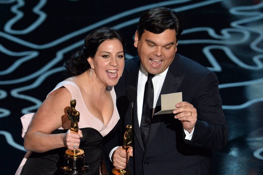 Songwriters Kristen Anderson-Lopez (L) and Robert Lopez accept the Best Achievement in Music Written for Motion Pictures, Original Song award for 'Let It Go' from 'Frozen' onstage during the Oscars at the Dolby Theatre on March 2, 2014 in Hollywood Photo: GETTY IMAGES