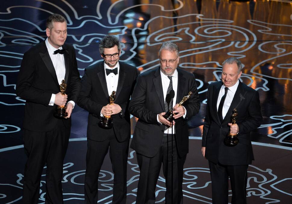 (L-R) Sound mixers Christopher Benstead, Niv Adiri, Skip Lievsay, and Chris Munro accept the Best Achievement in Sound Mixing award for 'Gravity' onstage during the Oscars at the Dolby Theatre on March 2, 2014 in Hollywood Photo: GETTY IMAGES