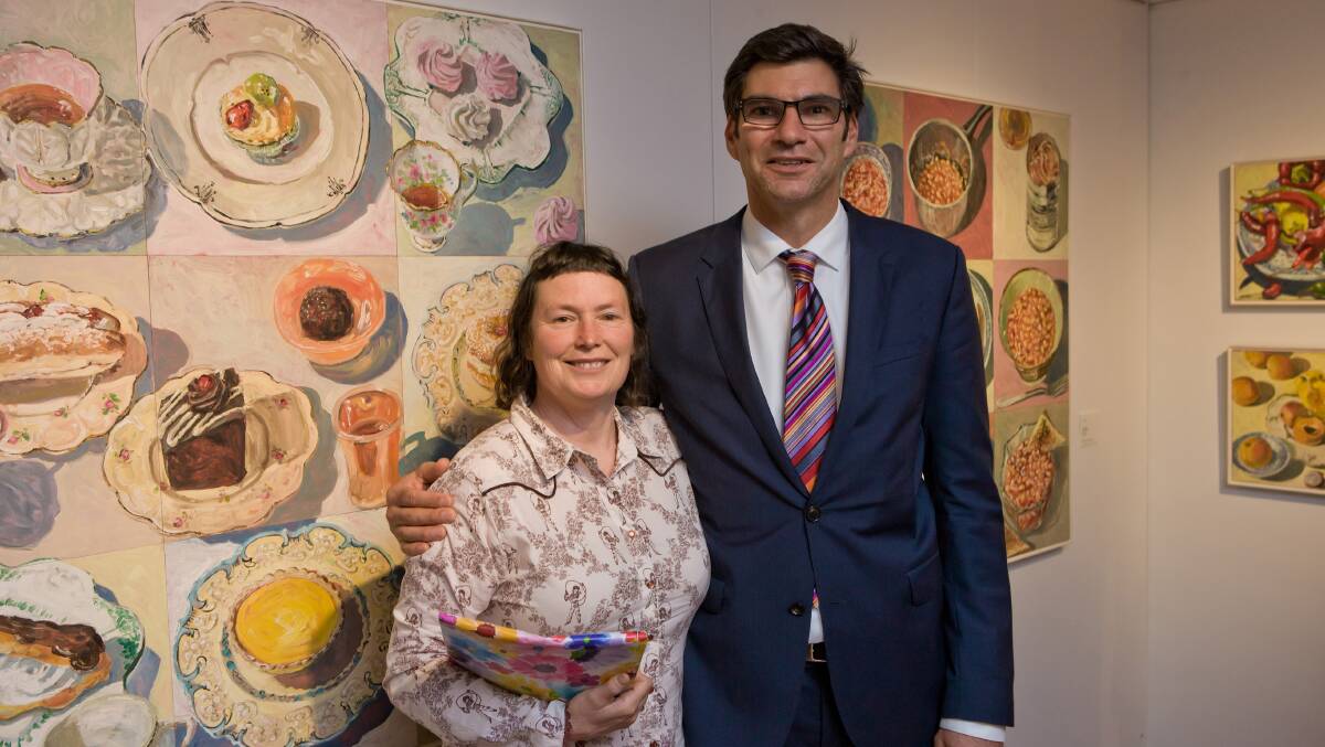 Local artist, Lucy Culliton and Lloyd Babb SC, who spoke at the opening of her exhibition, with the painting which won Lucy the 2000 Mosman Art Prize. 