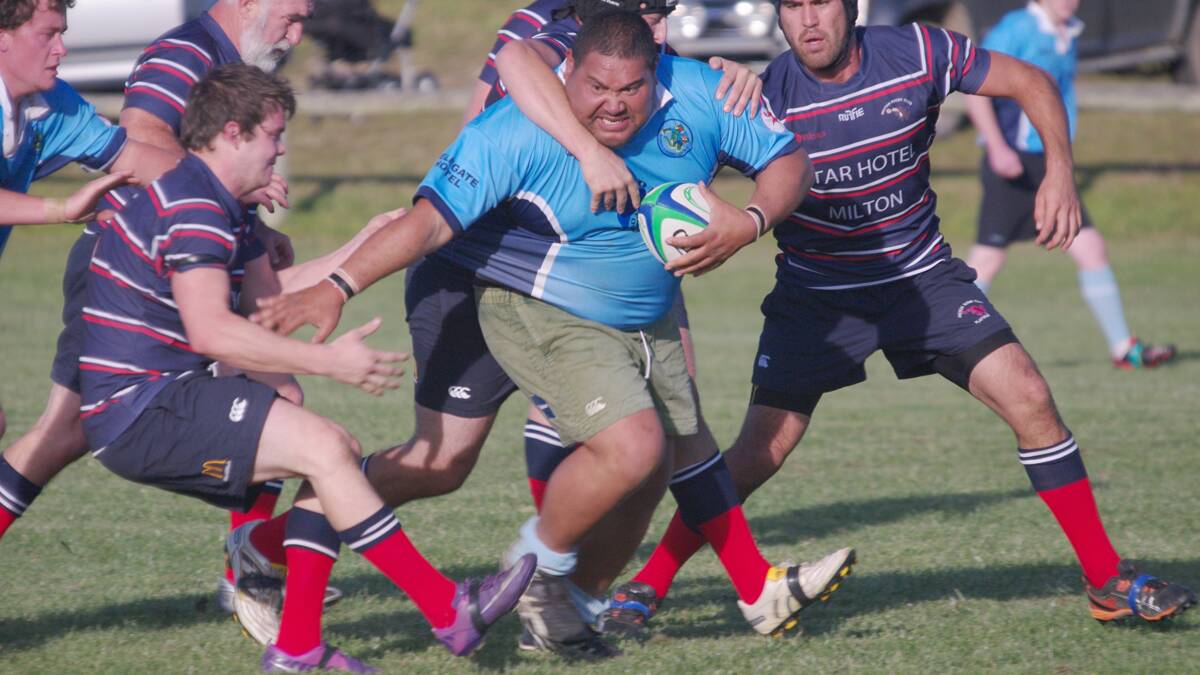 Bluetongues player Vinnie Papalii pushes through the defence of premiership favourites, the Milton-Ulladulla Platypus.
