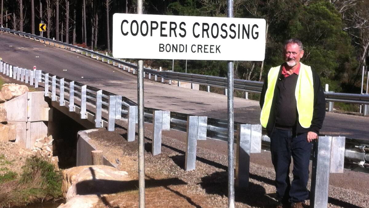 Bob Cooper beside the new bridge on Imlay Road.