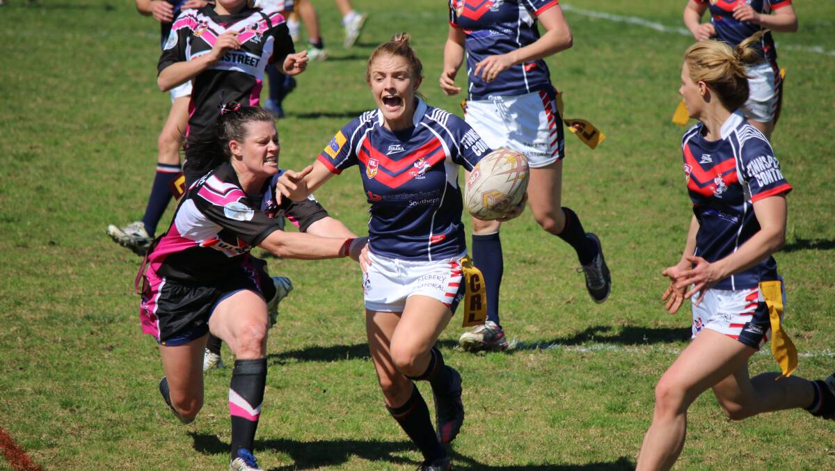 Bega Chick Tegan Mundy makes an emphatic charge as Cooma’s Maree Ingram closes in. 