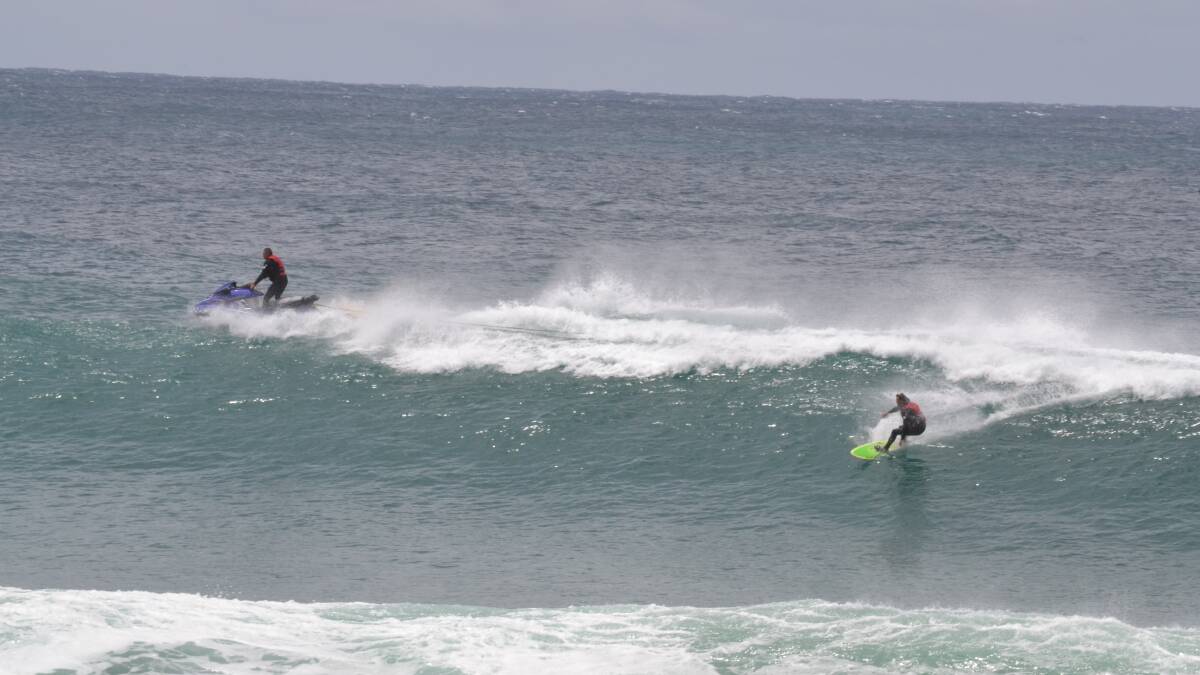 Photos of the tow-in surfing at the Narooma bar crossing