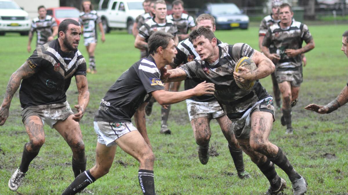 DIRTY DEEDS: Berry Magpies captain coach Nathan Benney brushes Port Kembla’s Josh Maude aside during their 30-4 victory on Saturday. Photo: PATRICK FAHY 