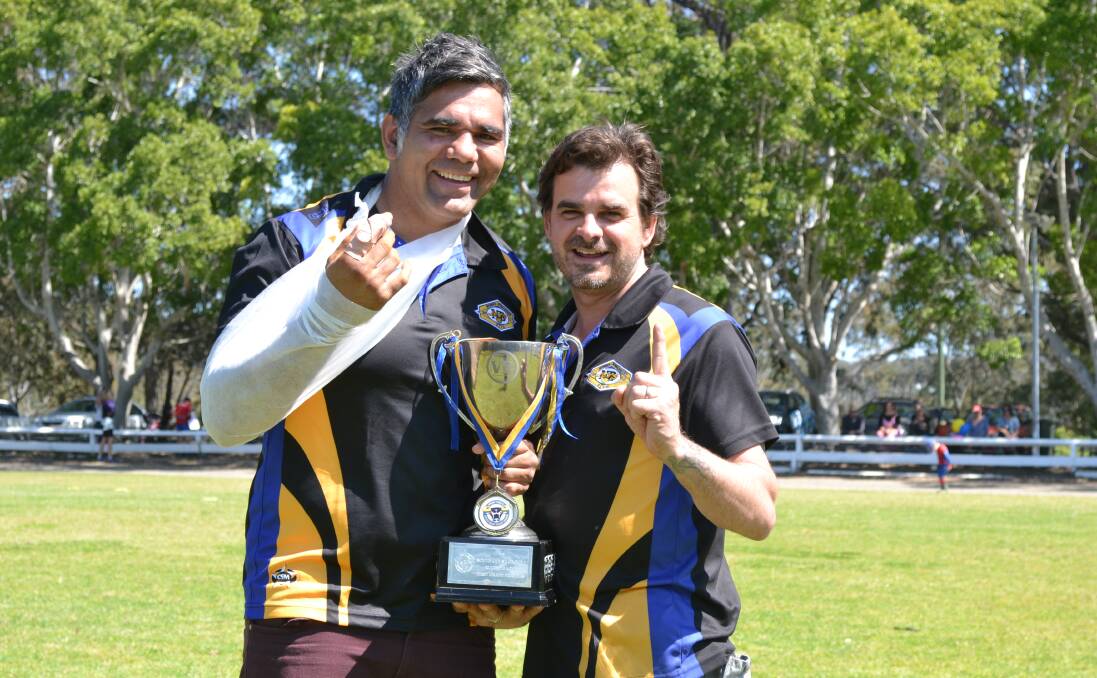 NUMBER ONE: Nowra-Bomaderry Jets captain-coach Ben Wellington and club president Dan Smith proudly show off the Group 7 premiership trophy at Nowra Showground. Photo: PATRICK FAHY  