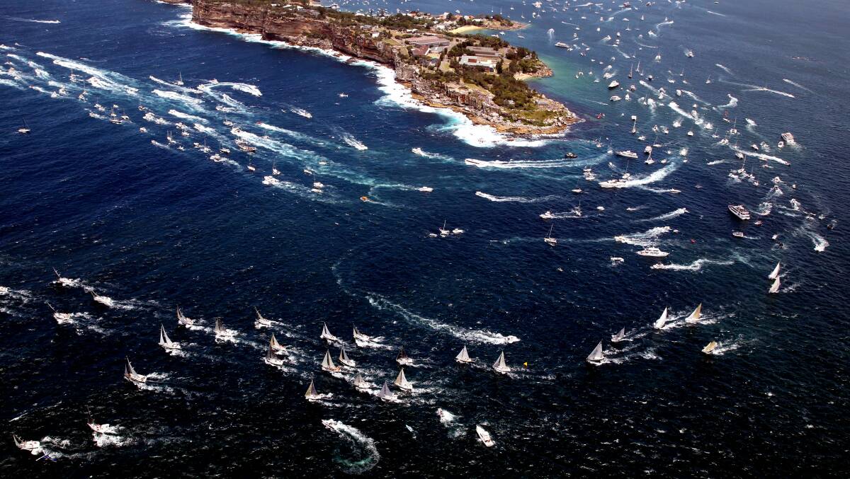 The start of the Rolex Sydney to Hobart yacht race 2012 as 77
competing yachts sail out of Sydney Harbour through the heads along
the NSW coast.