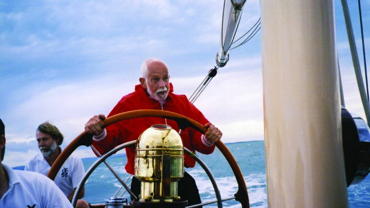 Terry Hammond at the wheel of a yacht.