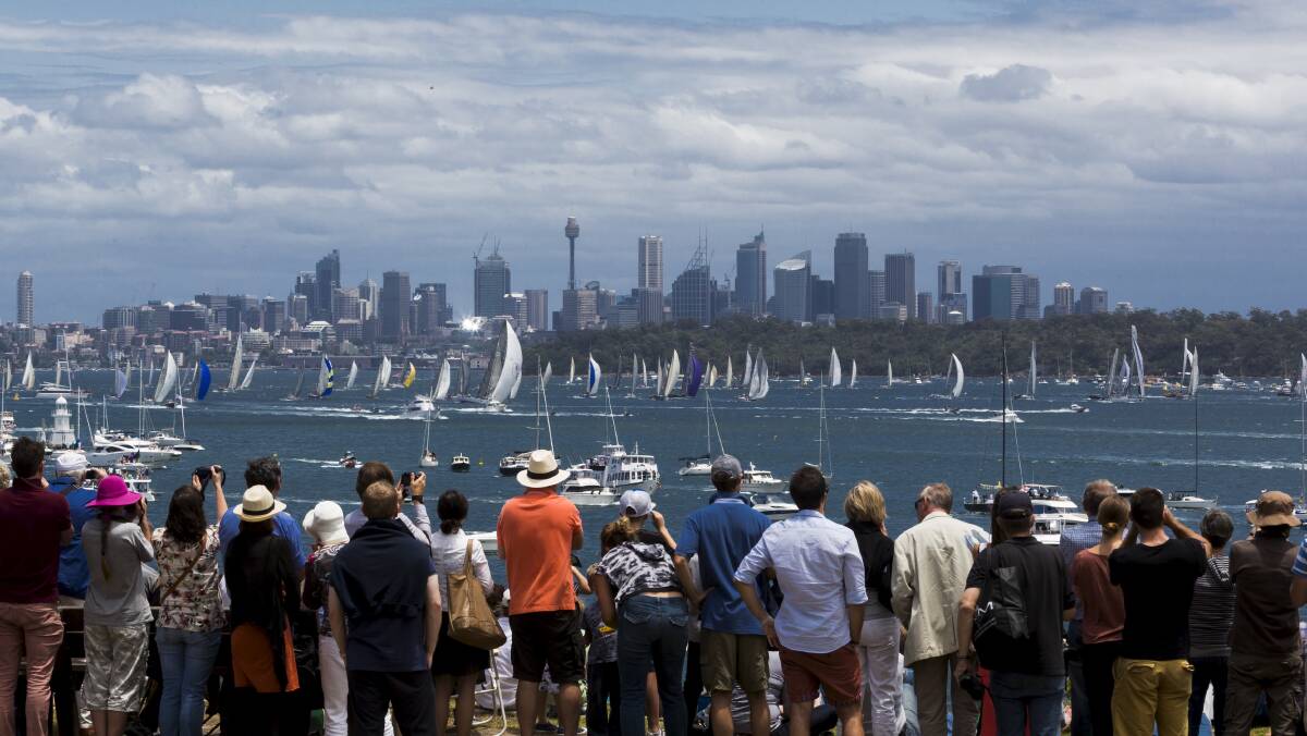 Crowds watch the fleet leave Sydney destined for Tasmania.