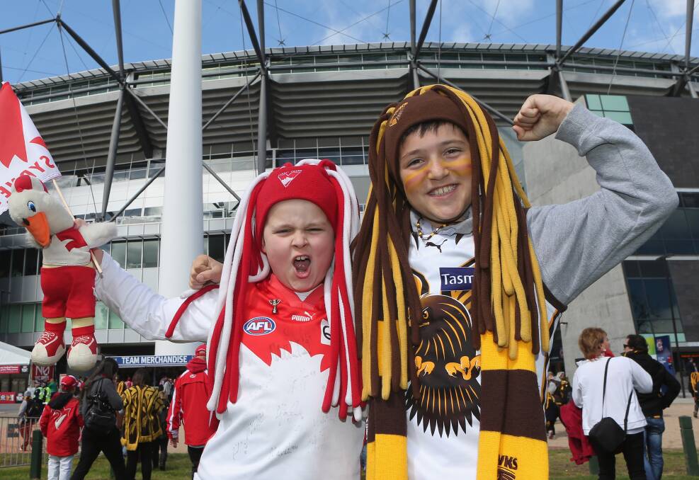 Opposing supporters at the 2012 grand final. Supporters will be looking forward to another close, hard fought game in 2014. Getty images