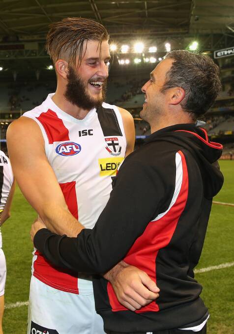 Josh Bruce of the Saints celebrates winning with assistant coach Lindsay Gilbee during the round five AFL match between the Essendon Bombers and the St Kilda Saints at Etihad Stadium on April 19, 2014 in Melbourne, Australia. Photo: Quinn Rooney/Getty Images.