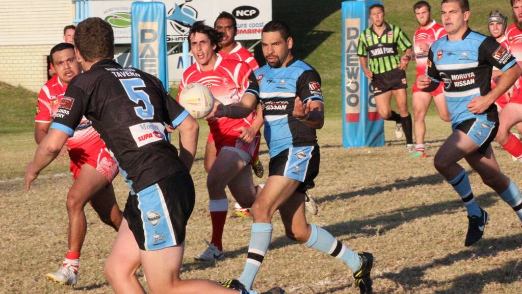 SOLID IN RETURN: Moruya Sharks were boosted by Caine Brierley (centre) who is pictured passing to winger Hayden Murray during the match against Narooma Devils at Ack Weyman Oval on Sunday. 