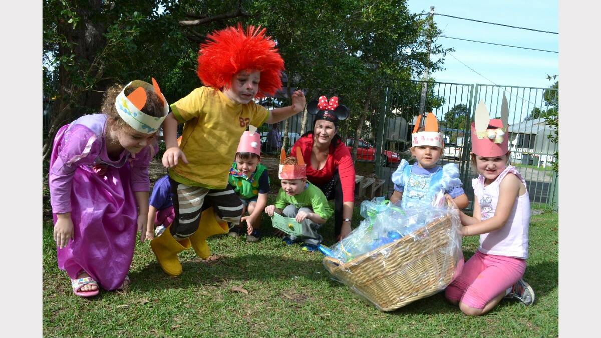 NOWRA: Shoalhaven Community Preschool students (from left) Elizabeth Doyle, Caleb Lawrence, Thomas McKeen, Eli Gow take part in the hop-athon, while Emily Hanley and Anna Duncan show off the Easter raffle prize with director Kim Stopuse-Lee.