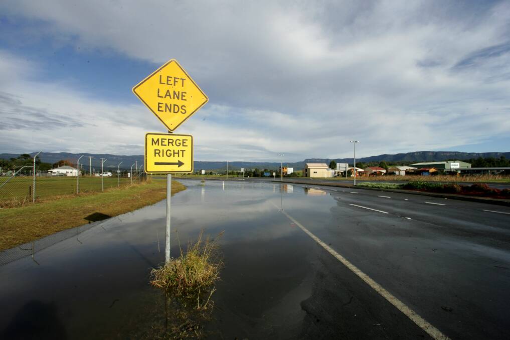 In June 2007 floodwaters ran over the Illawarra Highway at Albion Park again. Picture: SYLVIA LIBER