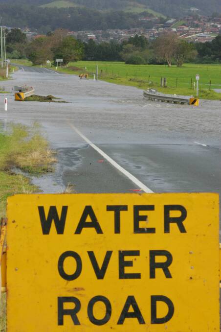 In June 2007 floodwaters ran over the Illawarra Highway at Albion Park again. Picture: ROBERT PEET