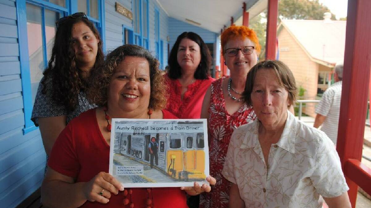 NAROOMA: Aunty Recheal Daley (front left), with her daughter Tathra Daley, artist Bethany Thurtell, author Phoenix Van Dyke and Tashe Long, facilitator of the Narooma Schools and Community Centres Project, at the book launch of “Aunty Recheal becomes a Train Driver” at Narooma Public School. 
 