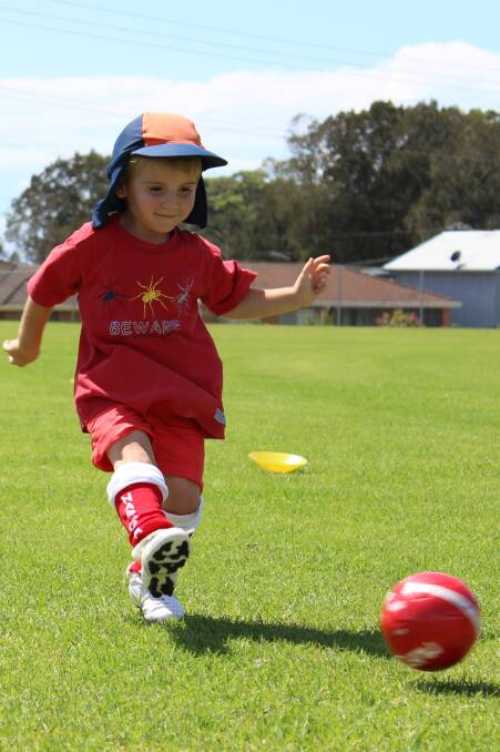 NAROOMA: Xavier Ridgely showed off his new socks and soccer skills at the Redbacks Welcome Day. Photo by Luke Seaman 