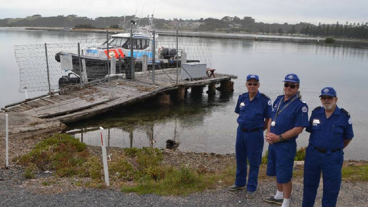 NAROOMA: Acting Narooma unit commander Eric Hibbett, senior skipper Ross Constable and volunteer Stan Swarbrick at the old falling down pontoon at Mill Bay. The process to install a new pontoon already purchased has begun with a new rescue boat arriving in March. 