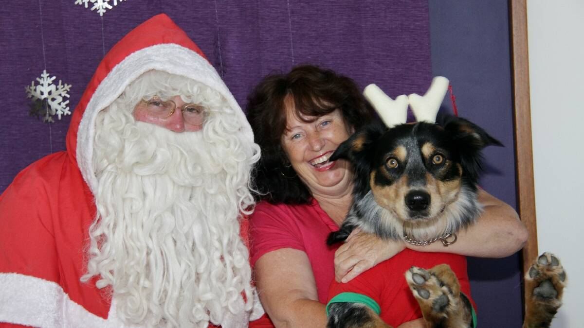 MERIMBULA: Ollie and Debbie Barratt had a jolly time at the annual Santa Paws event for pets in Merimbula.  