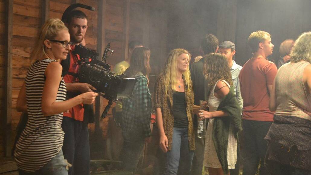 TILBA: On the set of the party scene for the short film 'Private Matter' shot at Tilba on Friday night are writer, producer, director Kate Halpin, cinematographer Phillip Staresinic on camera and local extra Sharyn Cowley of Narooma. 