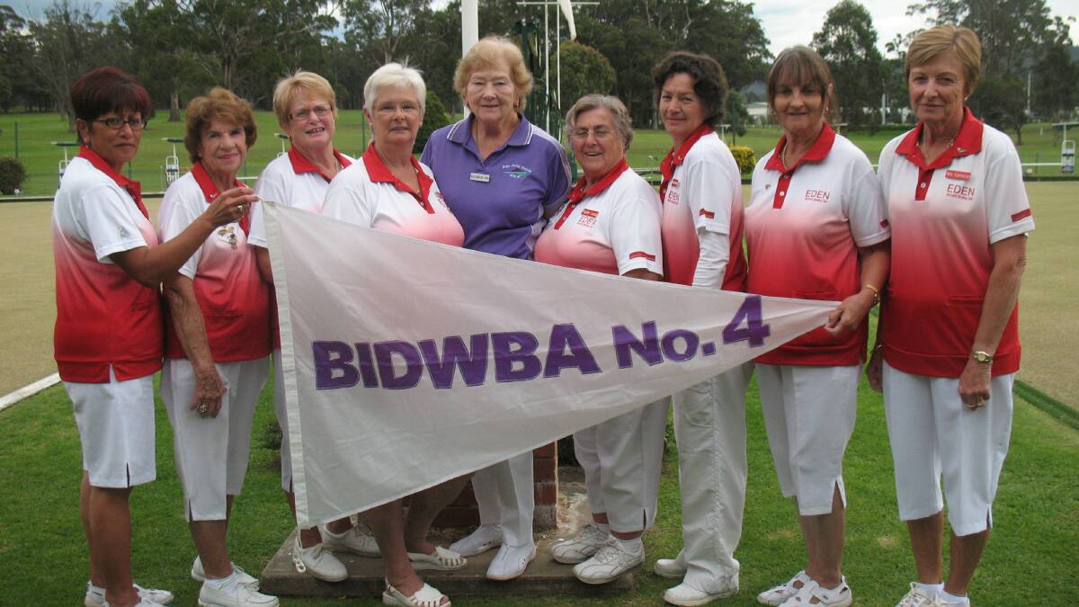 EDEN: District president Beryl McGrath-Smith (centre) presented the victorious grade four Eden women’s bowls team of (from left) Dianna Skipworth, Peg Davey, Jan Blaxter, Jan Key, Pauline Lucas, Maree Hendry, Robyn Symonds and Win Cameron with their third consecutive Pennant flag on Tuesday morning. 
