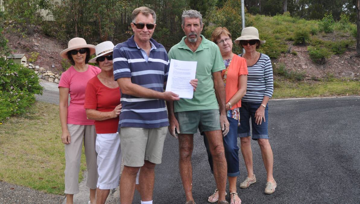 MERIMBULA: Road resurfacing rage … angry Merimbula residents Cathie Isaac, left, Patricia Little, Geoff Miller, Phil Hall, Lyn Hall and Helen Miller with the petition that was delivered to council.  